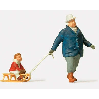 Preiser HO Man Pulling Child on Sled